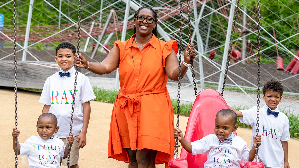 Ray-Family-adoption-twins Ray family on swings after the adoption finalization