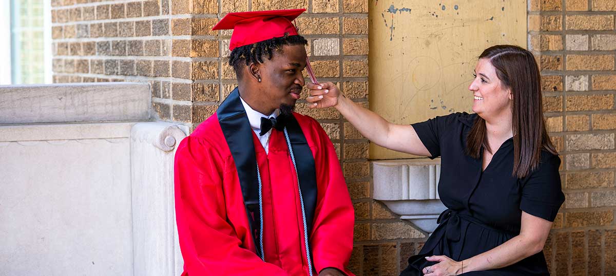 Brandon_LifeSet_1 LifeSet participant, Brandon in his cap and gown with his specialist Claudia