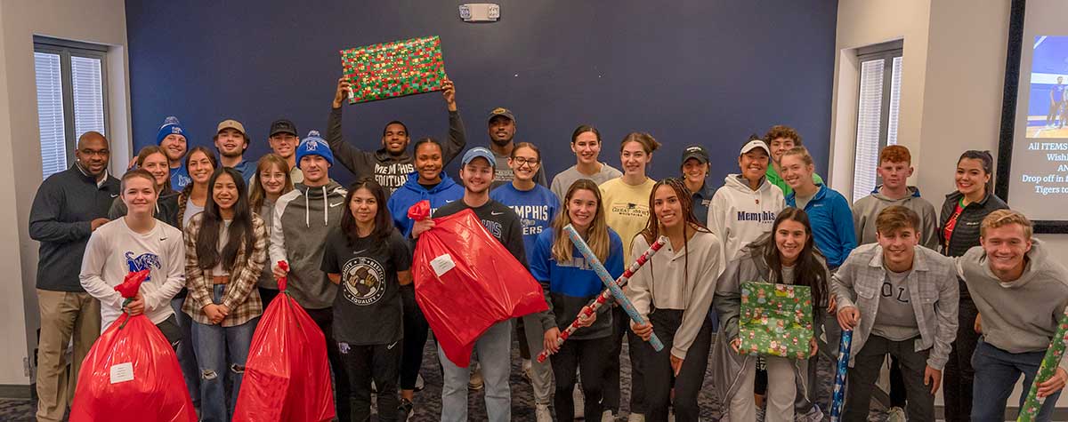 UofM_Athetics_HH_Wrapping_2022 University of Memphis Athletics wrapping presents for Holiday Heroes