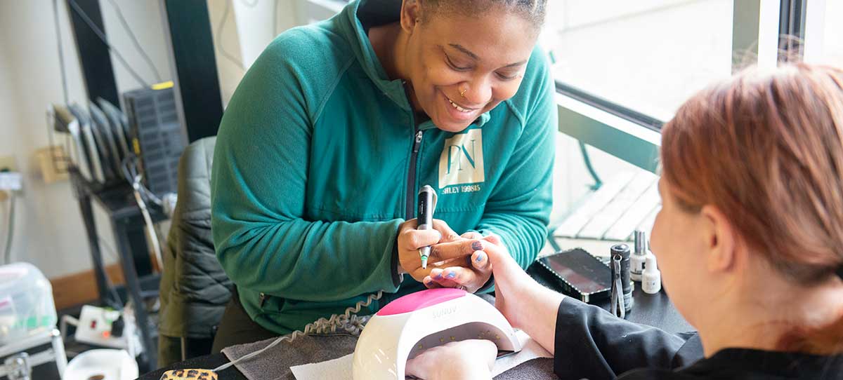 Janies-Fund-participant-getting-nails-done Youth from Janie's Fund getting her nails done