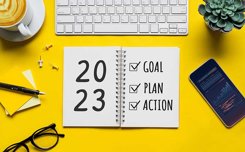jan23-pure-living 2023 new year goal,plan,action concepts with text on notepad and office accessories.Business management, Inspiration to success