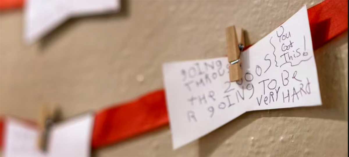 Words-of-encouragement-Oregon-Wall Words of encouragement are added to an anonymous message on a display at the Youth Villages office in Lake Oswego