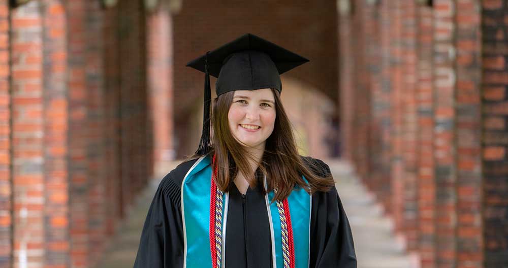 Abby_Graduation_2023 LifeSet participant and Scholar, Abby with graduation cap and gown