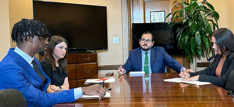 Brandon_Abby_speaking_with_congress_staff LifeSet participants, Brandon and Abby talking at a table with congress staff