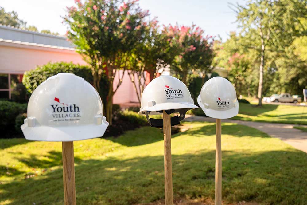 Dogwood_Groundbreaking_091123_001 Youth Villages hard hats sitting on top of shovels sticking up from the ground