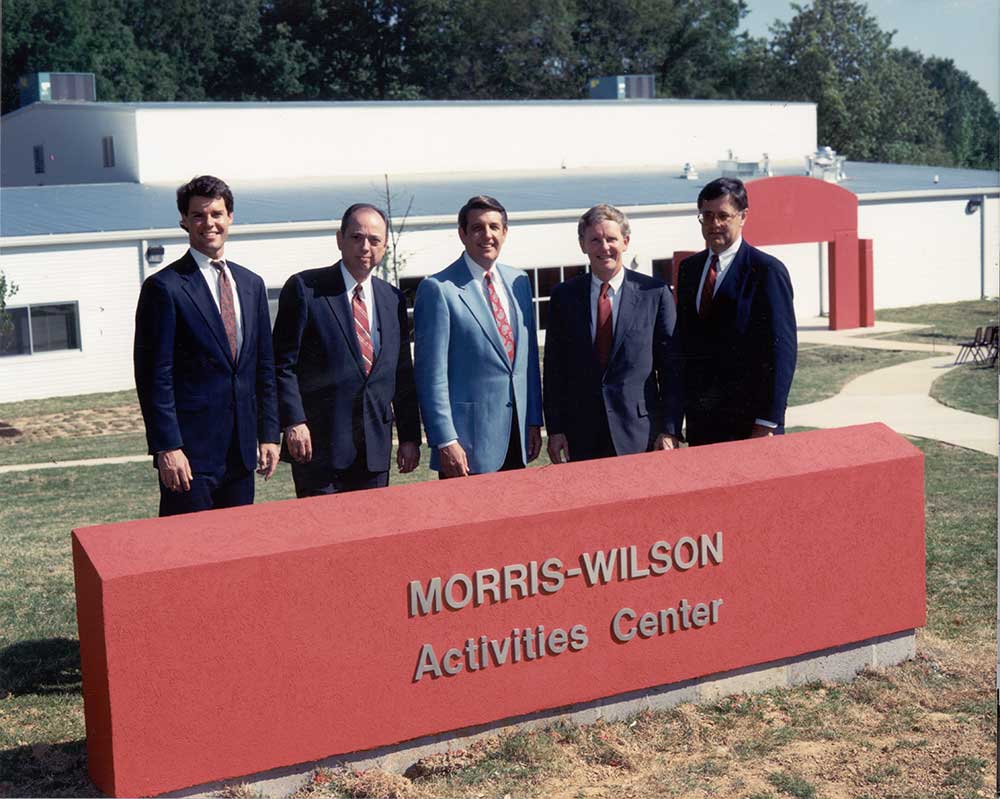 Pat_Lawler_Spence_Wilson_Dogwood_sign Pat Lawler, Spence Wilson and other supporters behind Morris-Wilson Activities Center sign