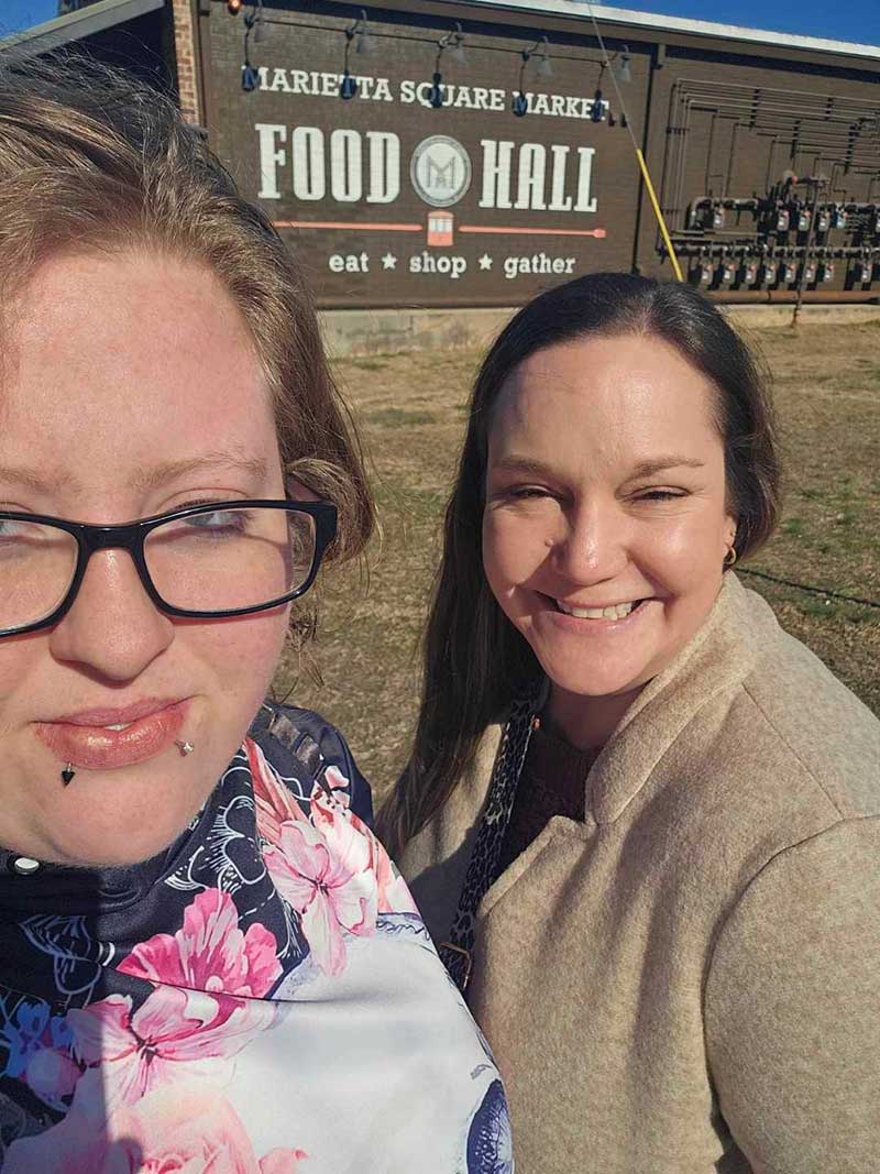 Lauren-Ky-mentorship Lauren spends quality time with mentee, Ky at a food hall in Marietta, GA