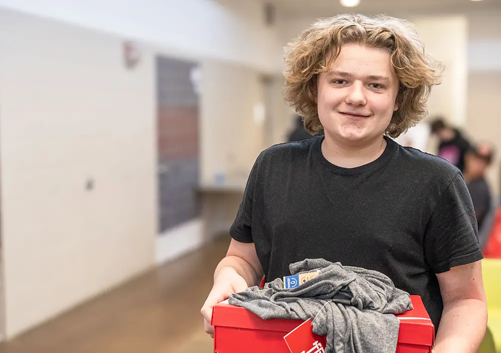 Youth gifted with new clothes youth with new set of clothes