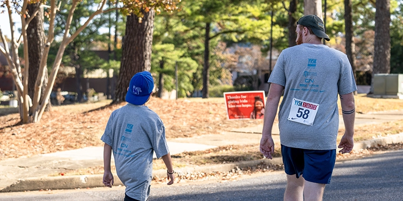 mentor-and-mentee-walking mentor and mentee walking at Youth Villages YV5K