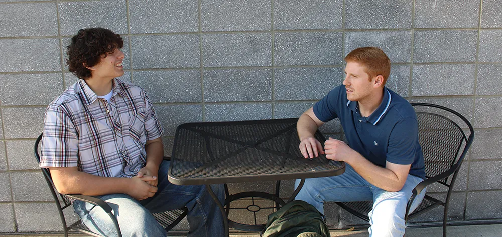 Oregon_ILP_Elijah Noah and Elijah sitting at a table talking