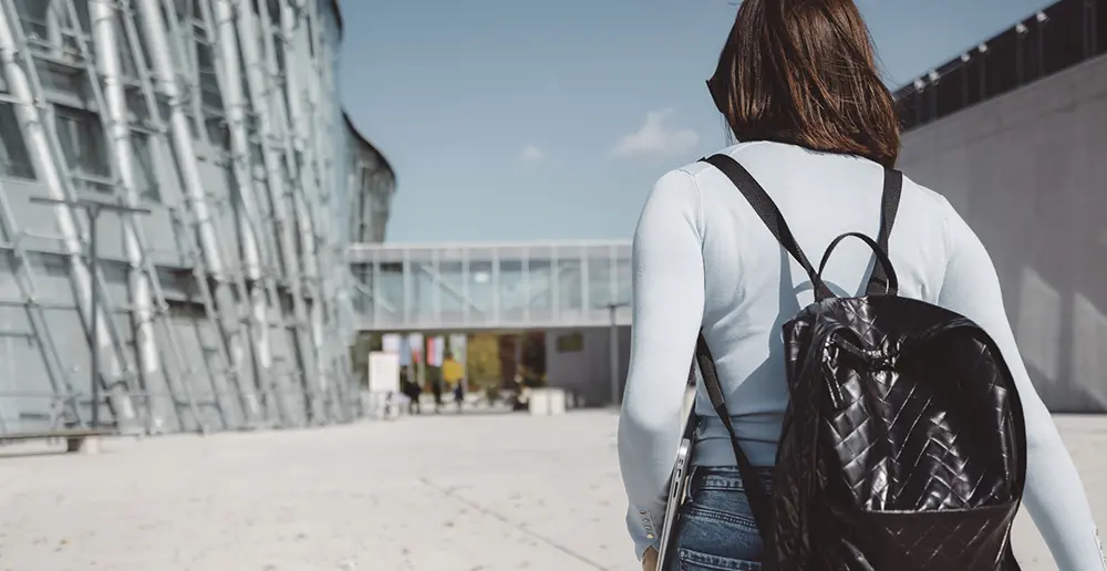 photo of young adult woman walking