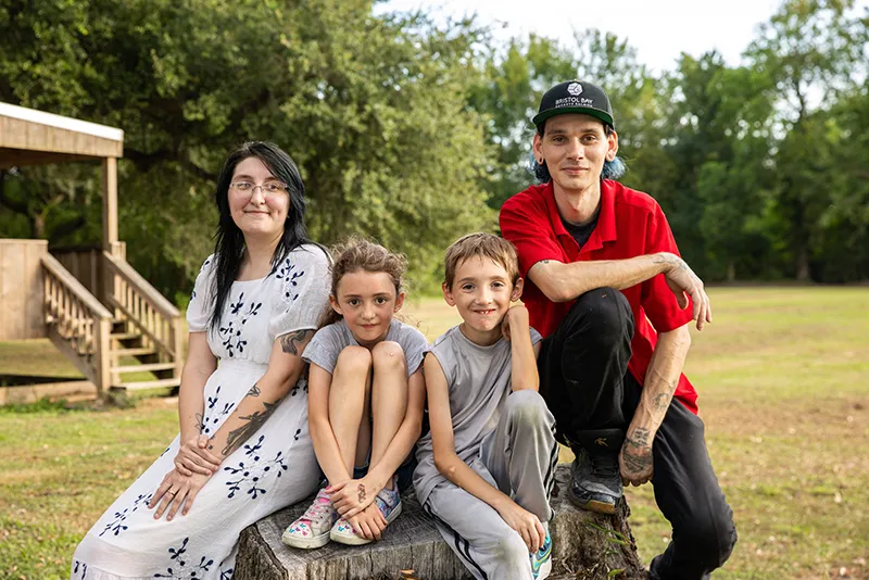 Youth-Villages-Intercept-family-sitting Youth Villages Intercept family sitting down smiling