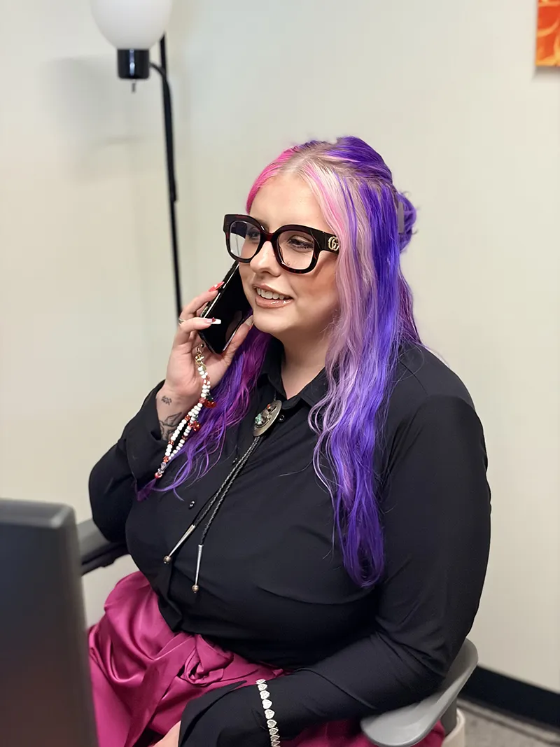 MadiHarp Madi in the office on the phone